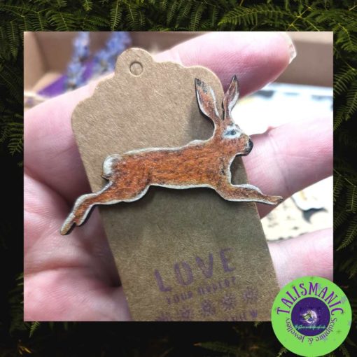 Leaping hare pin on a label backing